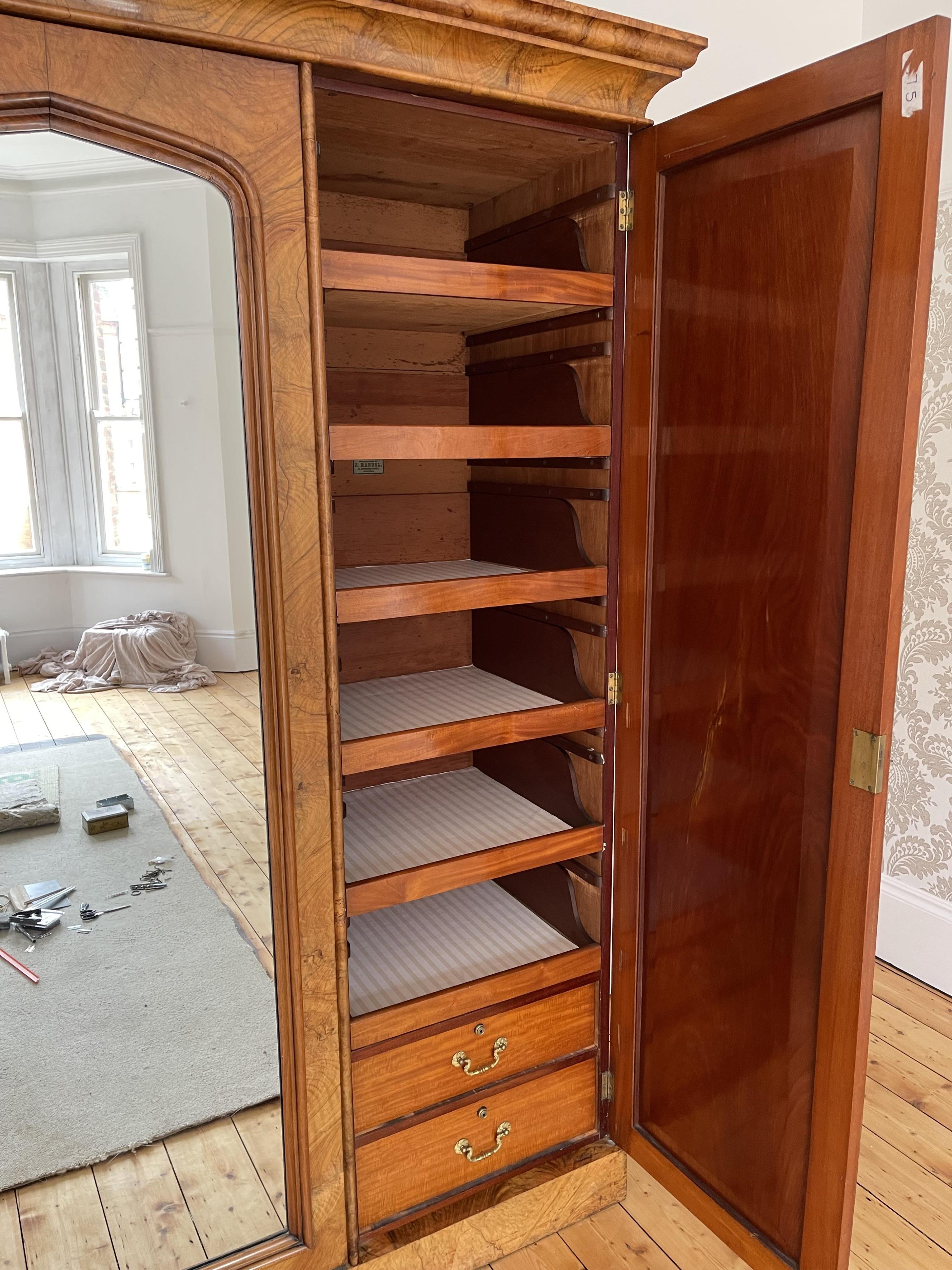 A Victorian walnut triple compactum wardrobe, width 201cm, depth 66cm, height 222cm. Condition - good